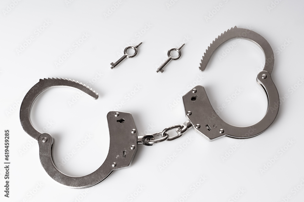 Handcuffs on a white background Handcuffs on a white background