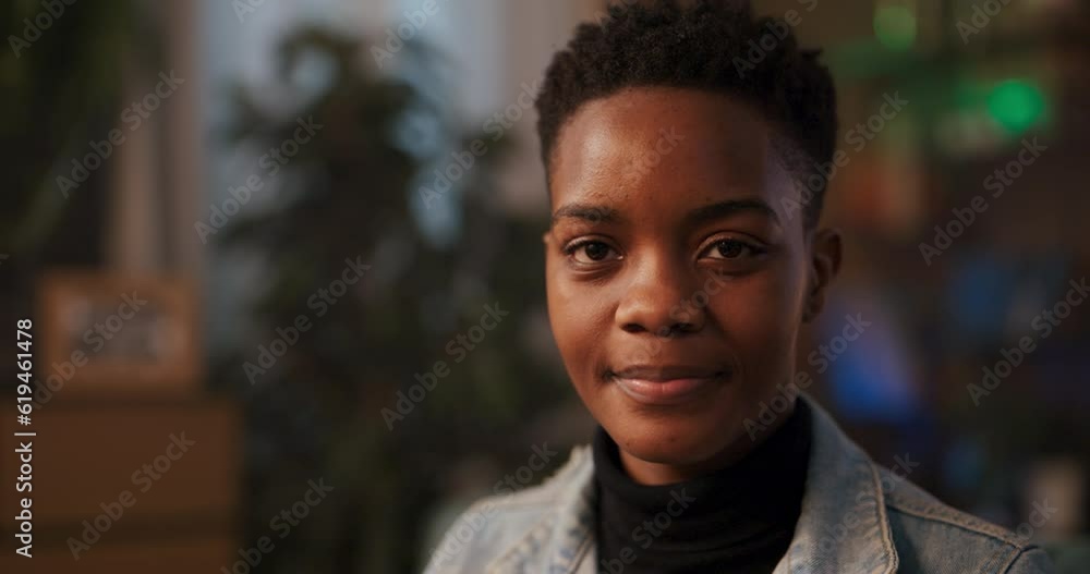 African woman with a short hairstyle, turning towards the camera with a radiant smile, exuding a sense of joy and contentment genuinely happy, suggesting a lighthearted and cheerful personality. African woman with a short hairstyle, turning towards the camera with a radiant smile, exuding a sense of joy and contentment genuinely happy, suggesting a lighthearted and cheerful personality.