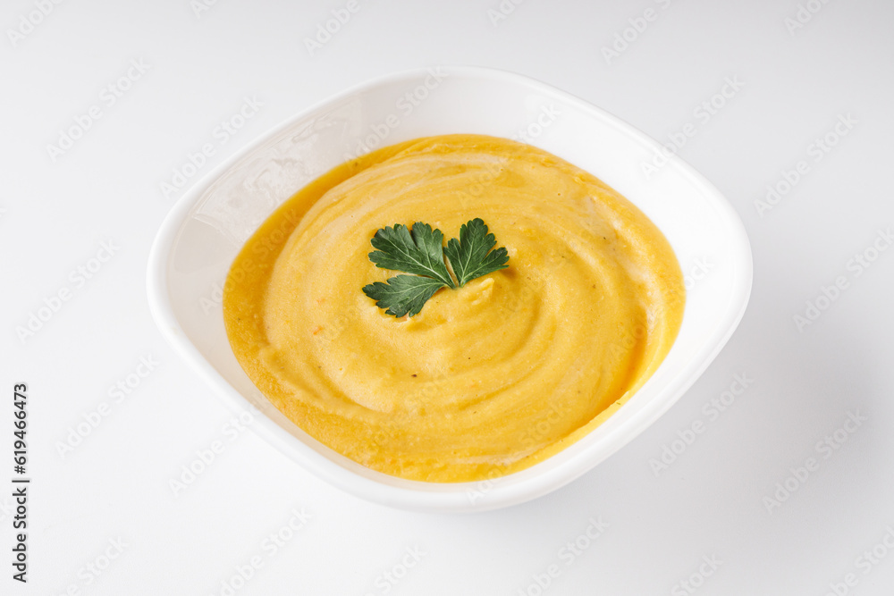 Cream soup from lentils, pumpkin, carrots on a white background Cream soup from lentils, pumpkin, carrots on a white background