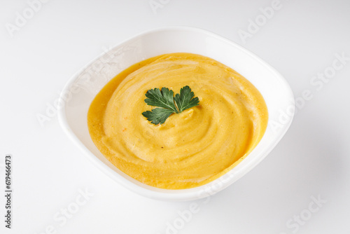 Cream soup from lentils, pumpkin, carrots on a white background