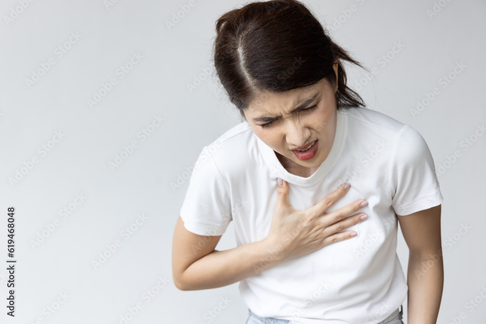 Health Issue concept, Asian Woman suffering from Heart condition, Heart attack with Discomfort and risk Health Issue concept, Asian Woman suffering from Heart condition, Heart attack with Discomfort and risk