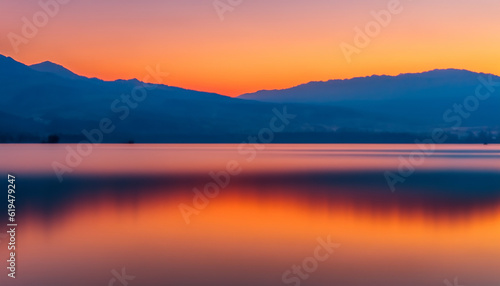 sunrise over the lake with mountain and orange sky