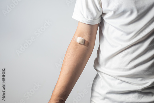 Male arm after venipuncture for annual check-up