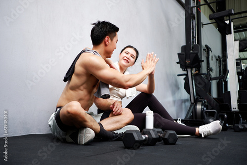 Fototapeta Naklejka Na Ścianę i Meble -  couple exercising in the gym fitness concept.