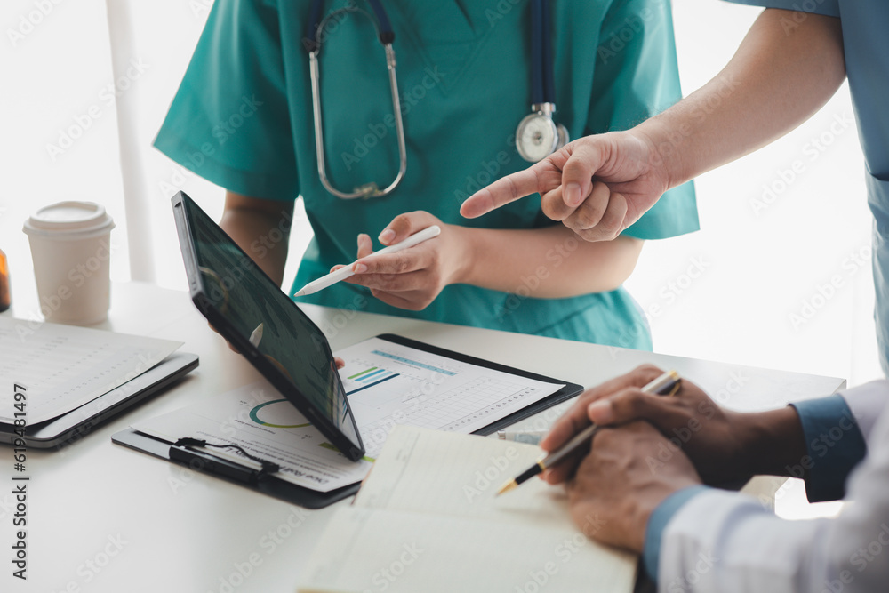 A conference room in a hospital where a group of doctors are attending a meeting, a meeting of executive doctors and chiefs meeting with pharmaceutical dealers. Doctor meeting concept. A conference room in a hospital where a group of doctors are attending a meeting, a meeting of executive doctors and chiefs meeting with pharmaceutical dealers. Doctor meeting concept.