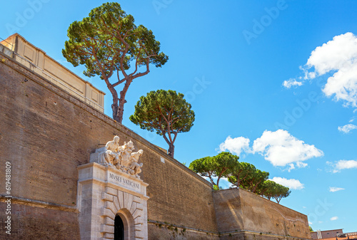 Entrance of Vatican Museum in old fortress wall in summer, Rome, Italy