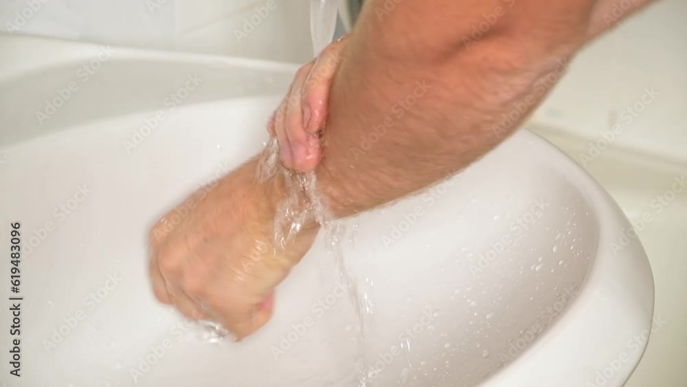 A man washes his hands with soap. Man's hands in foam with bubbles Wash your hands. Hands in soap with foam. A man washes his hands with soap. Man's hands in foam with bubbles Wash your hands. Hands in soap with foam.