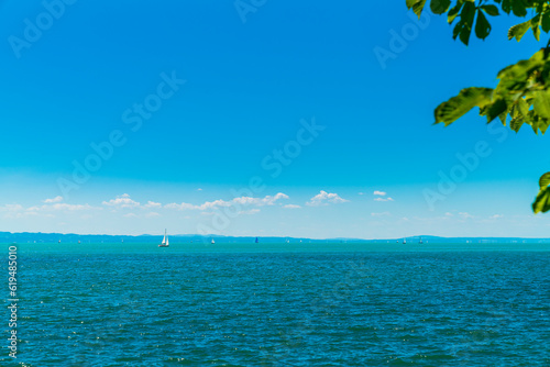 Obraz na płótnie Germany, bodensee lake constance panorama view, sunny day, many sailing boats enjoy the paradise like nature landscape and water sports w salonie