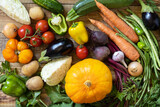 Fresh vegetables on a wooden background. Harvest. Vegetarian. Healthy diet concept. View from above.