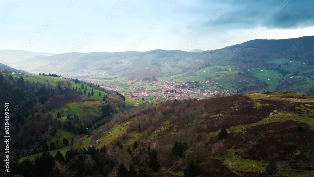 Drone Shot of city in the green mountains in France Drone Shot of city in the green mountains in France