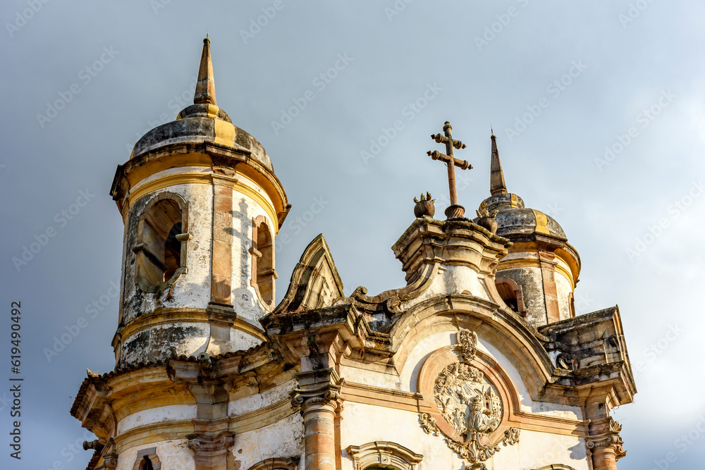 Detail of the facade and towers of a historic baroque church in the city of Ouro Preto in the state of Minas Gerais