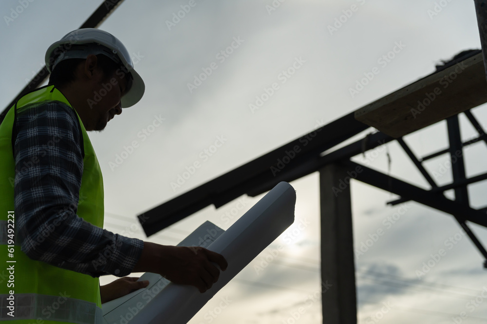 inspector or engineer is inspecting construction and quality assurance new house using a blue print. Engineer or architects or contactor work to build the house before handing it over to the homeowner inspector or engineer is inspecting construction and quality assurance new house using a blue print. Engineer or architects or contactor work to build the house before handing it over to the homeowner