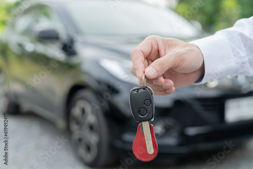 lease, rental car, sell, buy. Dealership manager send car keys to the new owner. Sales, loan credit financial, rent vehicle, insurance, renting, Seller, dealer, installment, car care business