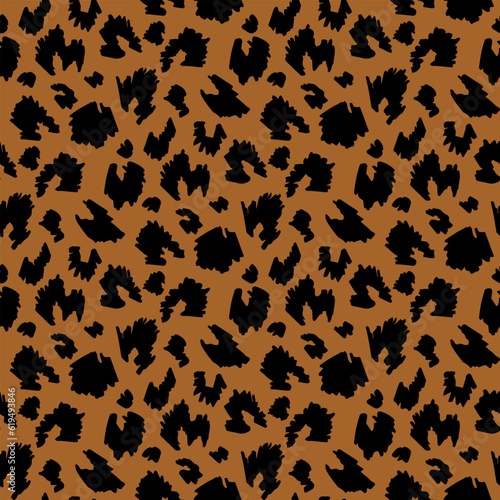 black animalistic pattern on brown background. Vector image.