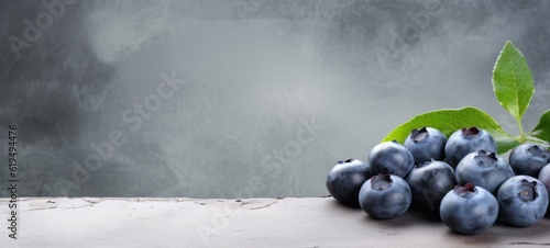 Food photography - Summer fruits blueberry background - Closeup of ripe blueberries with leaves on dark concrete table (Generative Ai)