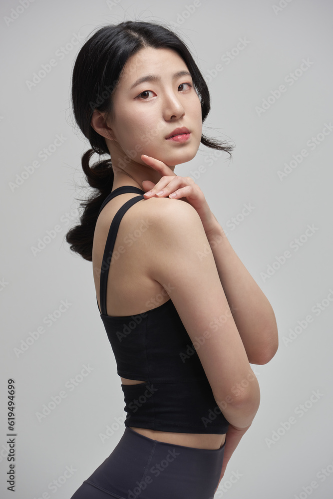 beautiful Asian woman exercising indoors beautiful Asian woman exercising indoors