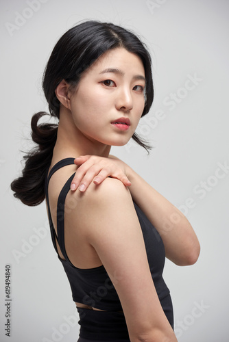beautiful Asian woman exercising indoors