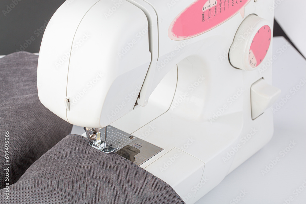 Sewing machine, stitching fabrics, needle in a round plan