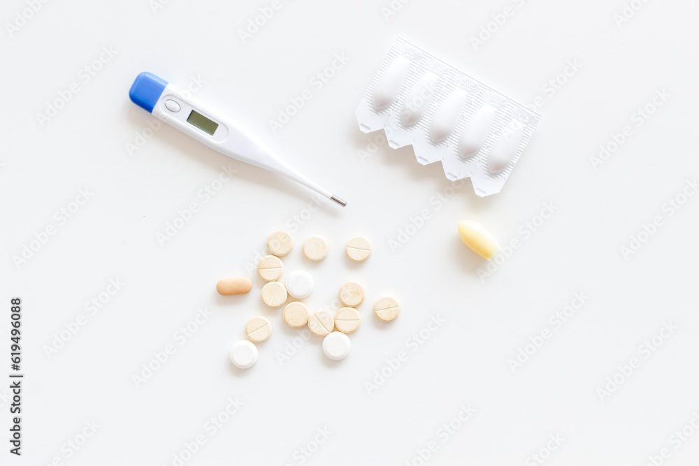 Medical treatment concept with thermometer pills and rectal suppositories Medical treatment concept with thermometer pills and rectal suppositories