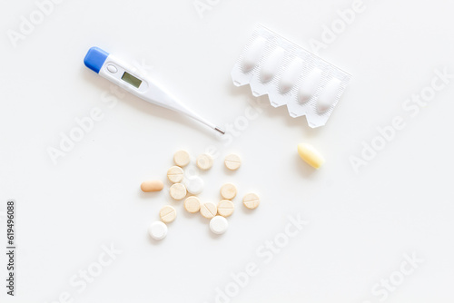 Medical treatment concept with thermometer pills and rectal suppositories