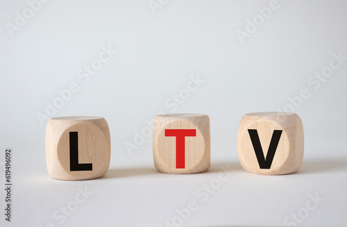 LTV - Life Time Value symbol. Concept word LTV on wooden cubes. Beautiful white background. Business and LTV concept. Copy space. © Natallia