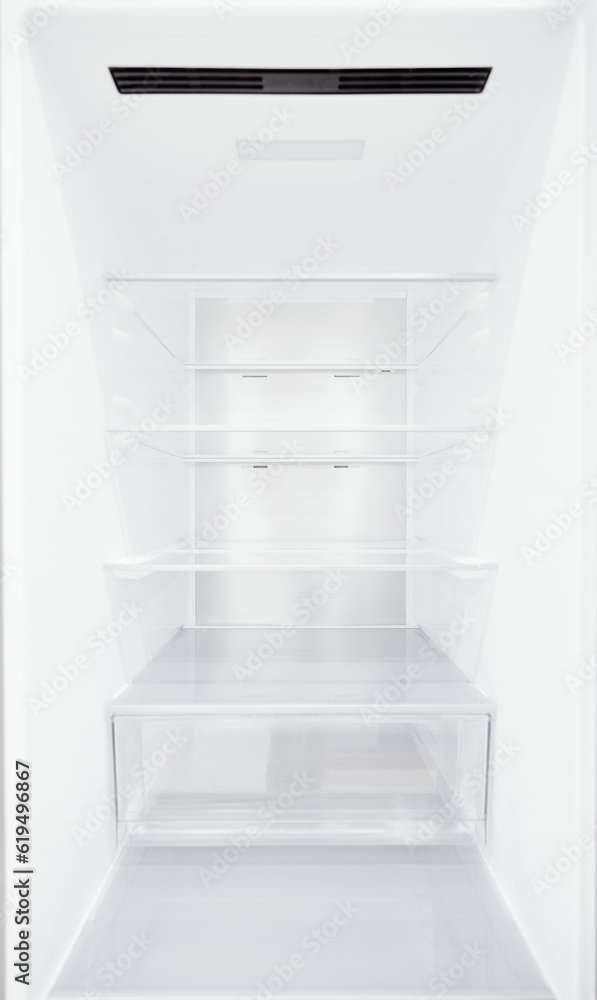 An empty refrigerator. Inside an empty, clean refrigerator, a refrigerator compartment after defrosting. shot with a wide angle lens An empty refrigerator. Inside an empty, clean refrigerator, a refrigerator compartment after defrosting. shot with a wide angle lens