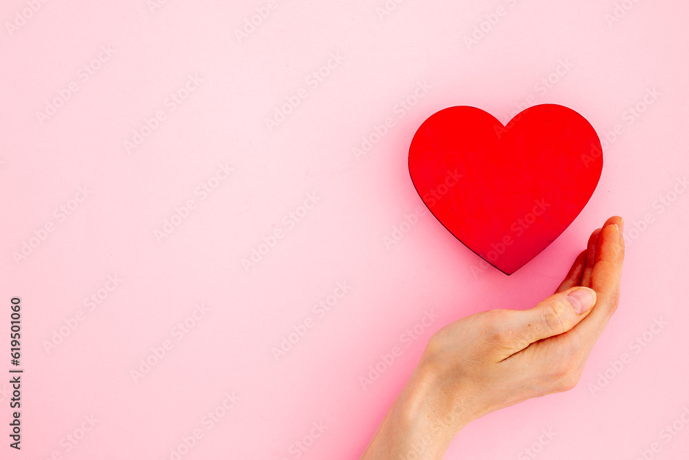 Medical and health care concept - heart with female hands Medical and health care concept - heart with female hands