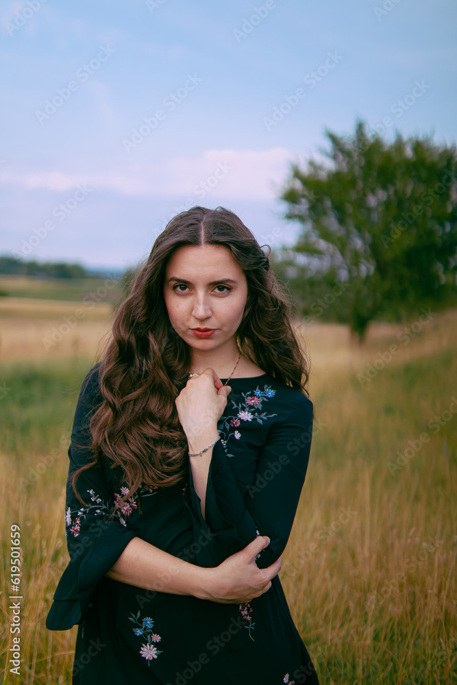 a mysterious woman stands in a field and looks at the camera. hair care.feels freedom.Loneliness,thoughts and dreams.hair care.
confidence.woman dreams.dreamer.Girl in sadness.tragic state.morbid.