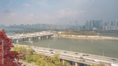 Seoul South Korea time lapse 4K, city skyline timelapse at Hangang Bridge Nodeulseom Island and Han River view from Yongbongjeong Park in autumn photo