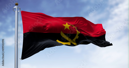 The national flag of Angola waving in the wind on a clear day