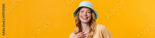 Young blonde woman wearing panama smiling and looking aside © Drobot Dean