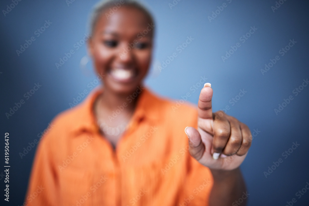 Finger, security and black woman user in studio on blue background for internet browsing or access to information. Future, hand and app with fingerprint biometrics of a female person on an interface Finger, security and black woman user in studio on blue background for internet browsing or access to information. Future, hand and app with fingerprint biometrics of a female person on an interface