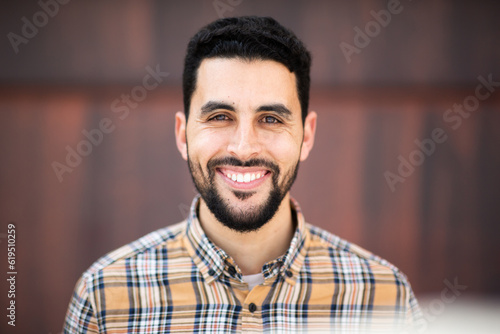 Portrait of handsome young arabic man smiling