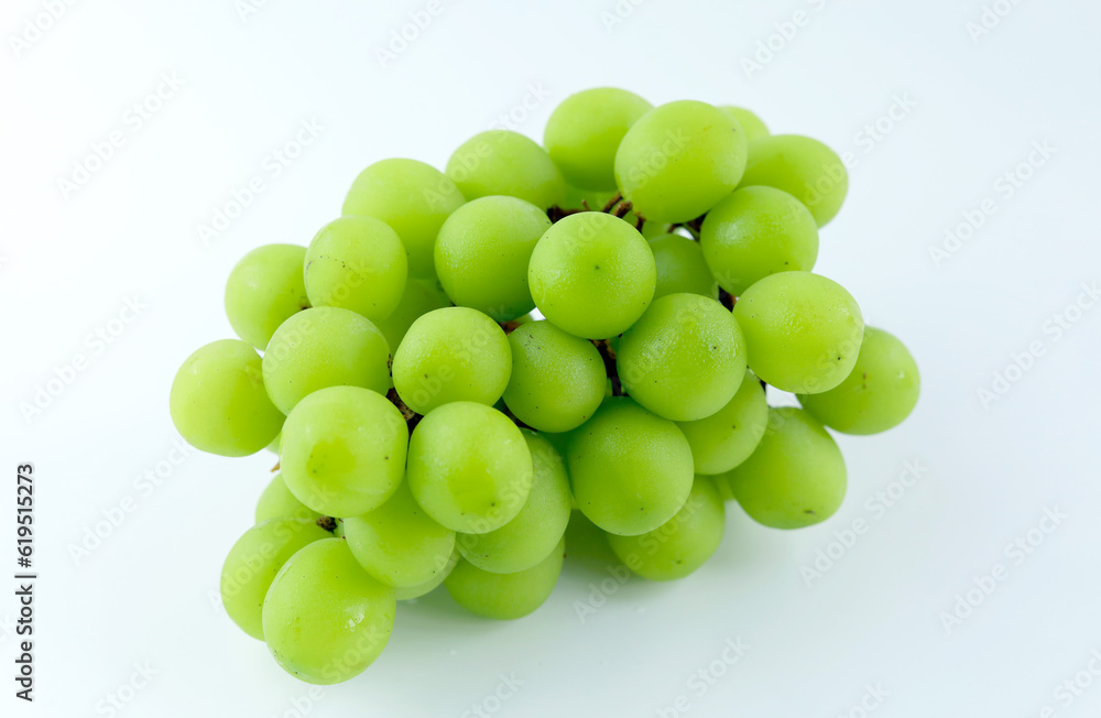 Fresh Shine Muscat grapes on a white background. Sweet green grapes Fresh Shine Muscat grapes on a white background. Sweet green grapes