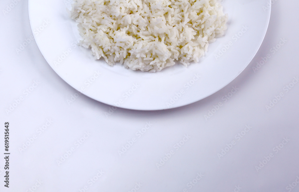 Cooked white rice on a plate and isolated on white background Cooked white rice on a plate and isolated on white background