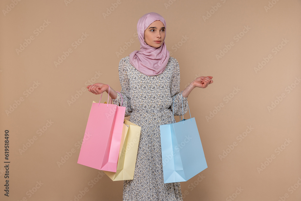 Fototapeta premium Slim pretty young woman with shopping bags