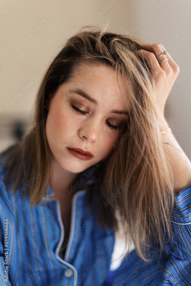 Portrait of young beautiful woman with closed eyes.