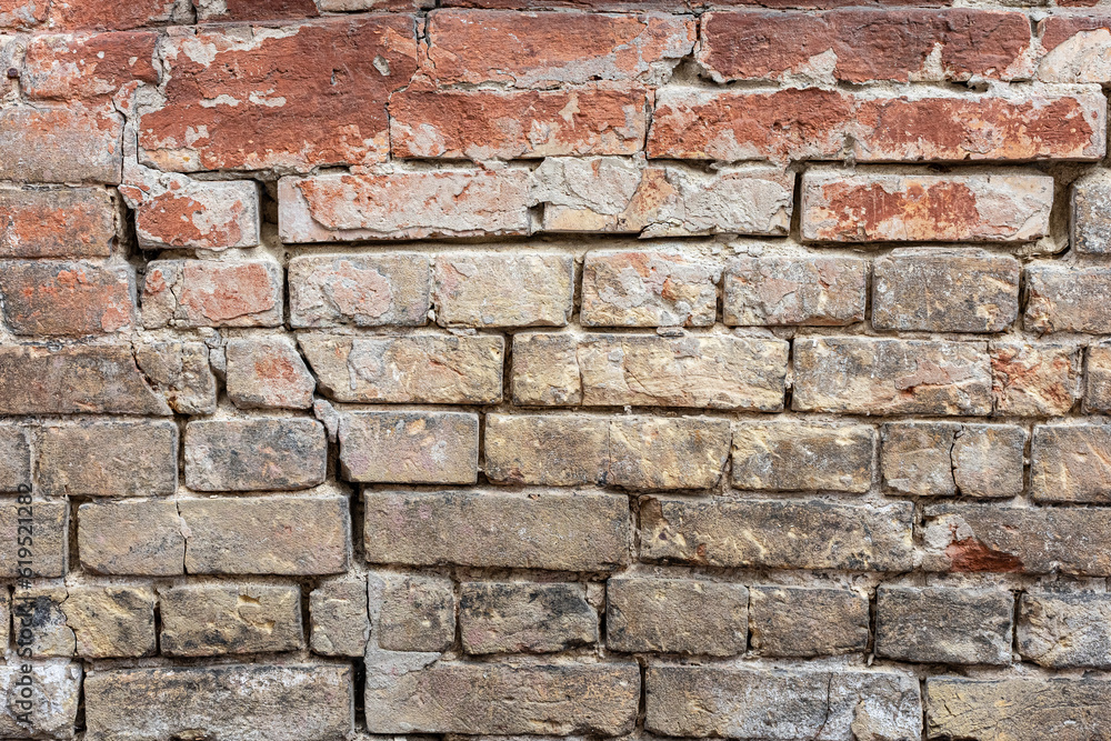 Red, White, Green, Pink, Paint, Mold, Wall Background. Old Grungy Brickwork Horizontal Texture. Brickwall Backdrop. Structure With Broken Stucco And Plaster. Red, White, Green, Pink, Paint, Mold, Wall Background. Old Grungy Brickwork Horizontal Texture. Brickwall Backdrop. Structure With Broken Stucco And Plaster.