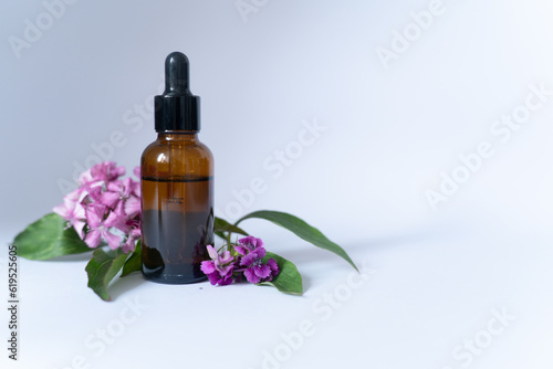 Serum Cosmetic Bottle With Peptides And Retinol with flowers