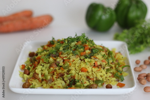 Billede på lærred Vegetable Poha is a quick breakfast or snack made of beaten rice or flattened rice along peanuts, carrots and chilies