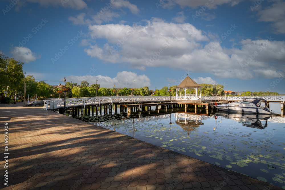 Bridge and promenade on the lake in the city of Ostroda, Poland.