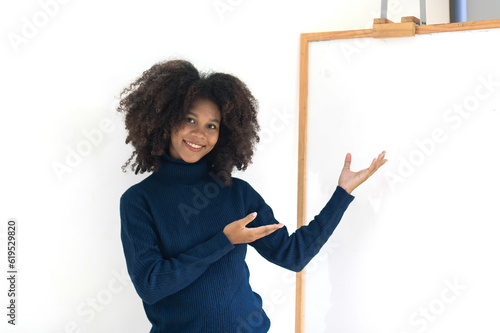 Young freelance african american business woman standing in meeting room, presenting or explaining. Images that can be further developed into edited works.