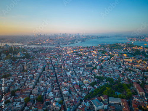 Nuruosmaniye Mosque and Sultanahmet aerial view with Golden Horn and Bosphorus Strait at sunset in city of Istanbul, Turkey. Historic Areas of Istanbul is a UNESCO World Heritage Site. 