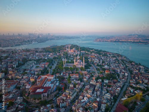 Blue Mosque Sultan and Hagia Sophia aerial view at sunset with Bosphorus Strait in Sultanahmet in city of Istanbul, Turkey. Historic Areas of Istanbul is a UNESCO World Heritage Site since 1985. 