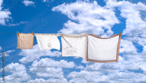 Fresh hung laundry against a blue sky and clouds. photo