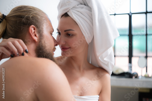 Portrait of young couple in spa salon. Man and woman after shower.