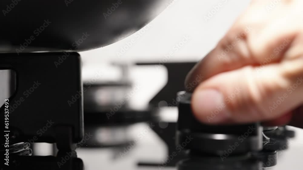 In slow motion, I turn the knob on the gas stove and ignite the burner to heat up the pan. In slow motion, I turn the knob on the gas stove and ignite the burner to heat up the pan.