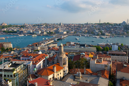 Karakoy and Gatala Koprusu Bridge across Golden Horn aerial view from top of Galata Tower with historic Eminonu at the background in Beyoglu historic district in city of Istanbul, Turkey. 