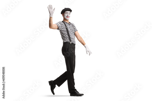 Full length shot of a mime walking and waving © Ljupco Smokovski