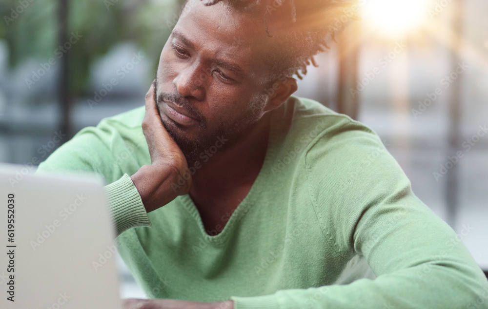 Fototapeta premium Business man in casual clothes thinking behind a laptop